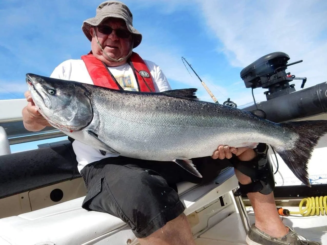 Angler with Trophy Chinook Red Vest