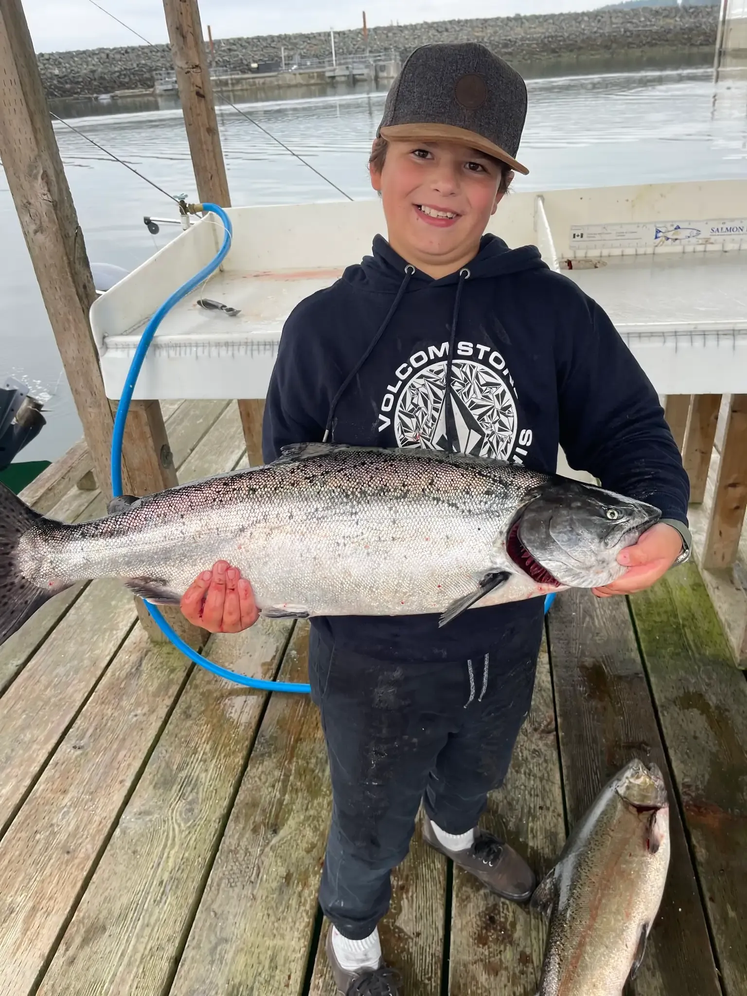 Junior Angler Boy with Salmon at Dock