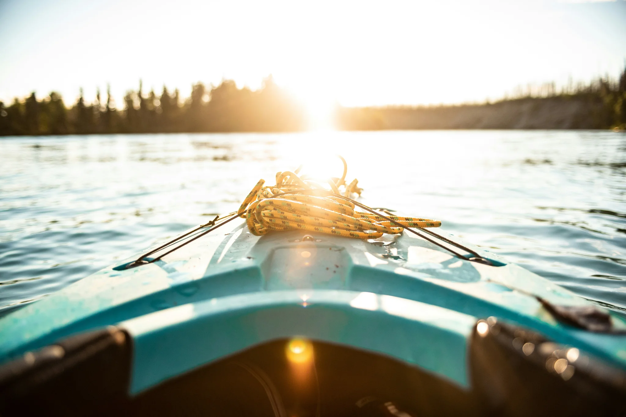 Kayaking at golden hour on calm waters